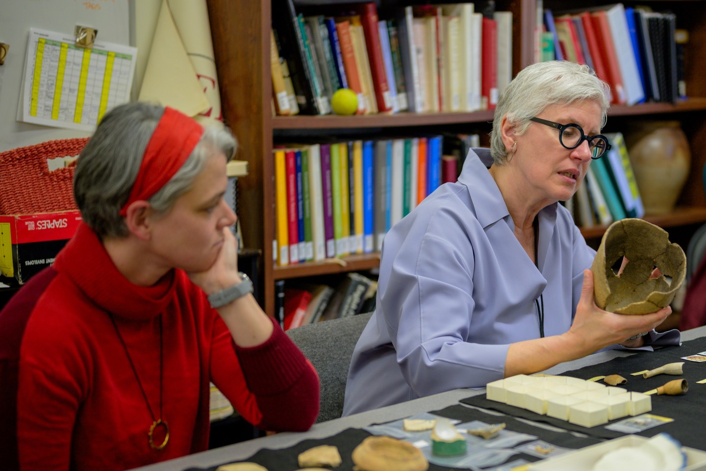 Kamensky investigating a Native American pot