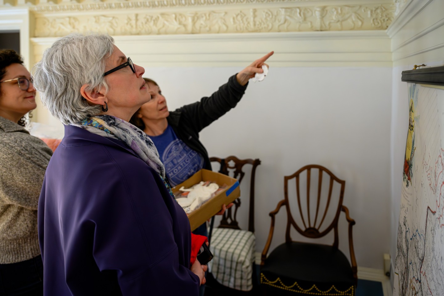 Jane Kamensky and Monticello's Senior Restoration Specialist Carol Richardson examine details on plasterwork on the second floor of the house
