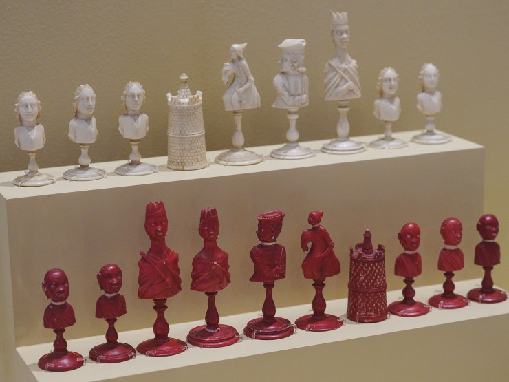 Pieces from a chess set reportedly given to Jefferson with the white pieces depicted with European features and the red pieces depicted with African features