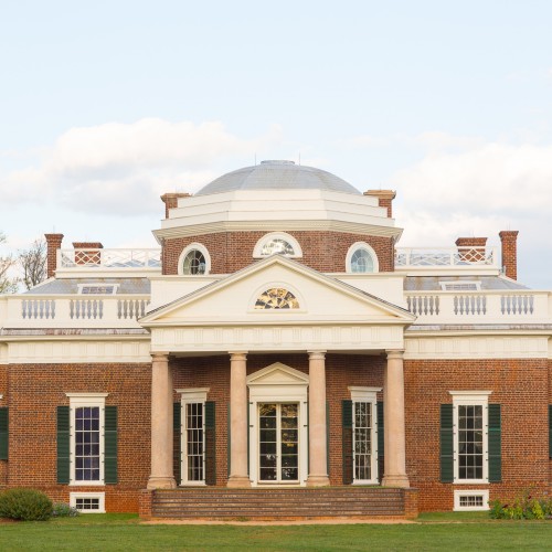 The West Front of Monticello and its dome with a light blue sky behind
