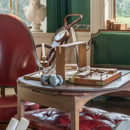 Photo of furniture and objects in Monticello's "Cabinet" room, a space used by Thomas Jefferson for academic pursuits and correspondence