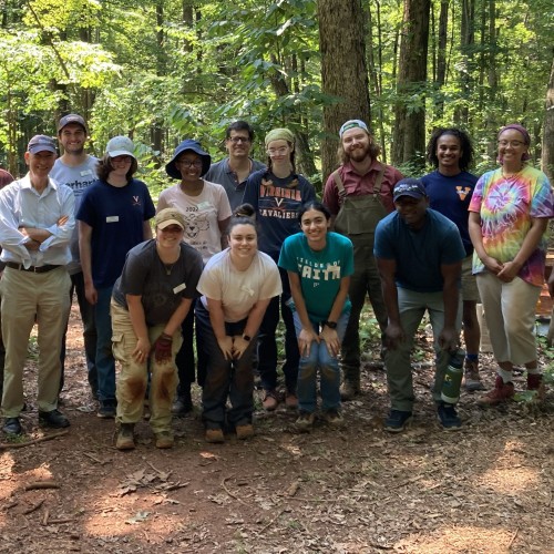Staff and students of the 2023 field school pose for a group photo in the field