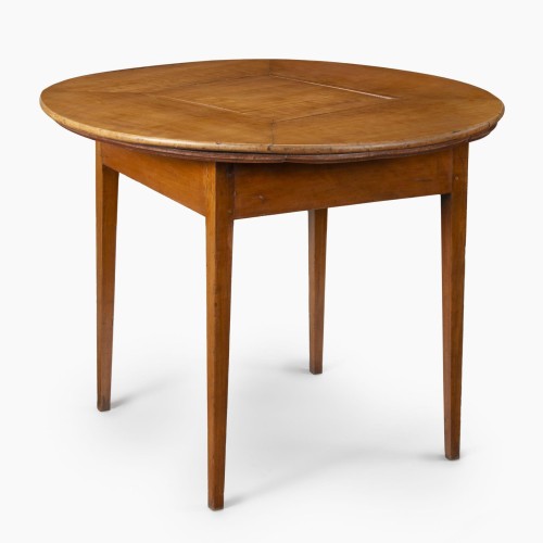 Photo of a circular wooden table with a revolving top, made by John Hemmings in Monticello's Joiner's Shop and to be used by Thomas Jefferson and his family