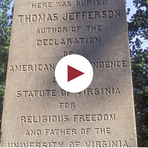 Detail of Jefferson's obelisk gravemarker with play button over the inscription