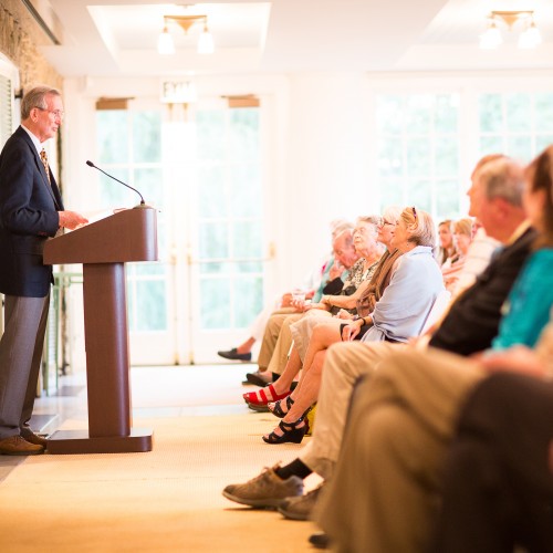 Participants listen to a speaker at an educational event hosted on Montalto