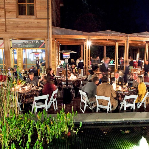 Guests enjoy a party in the courtyard of the visitor center at Monticello